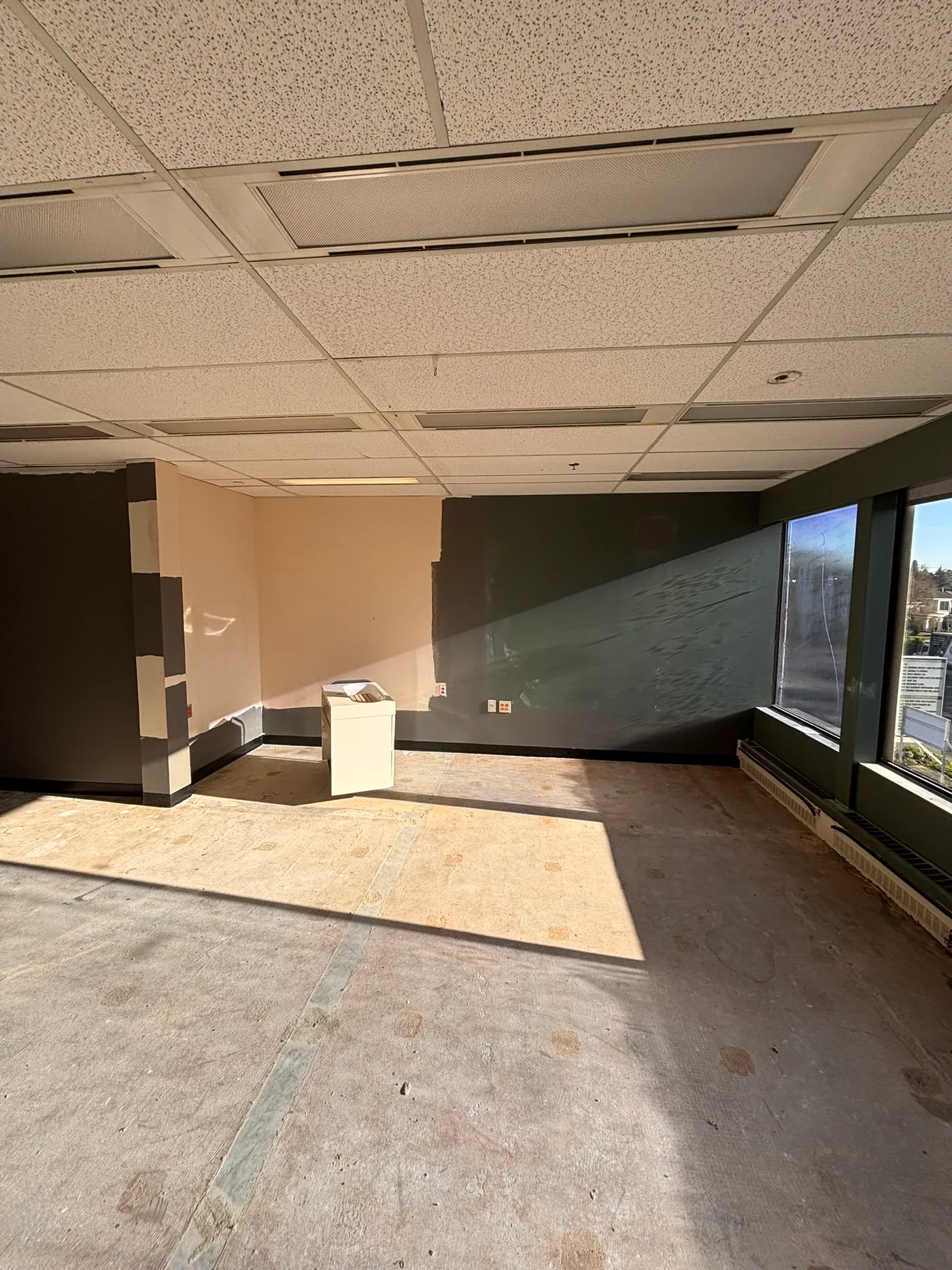 Original clinic space with paint samples being tested on walls